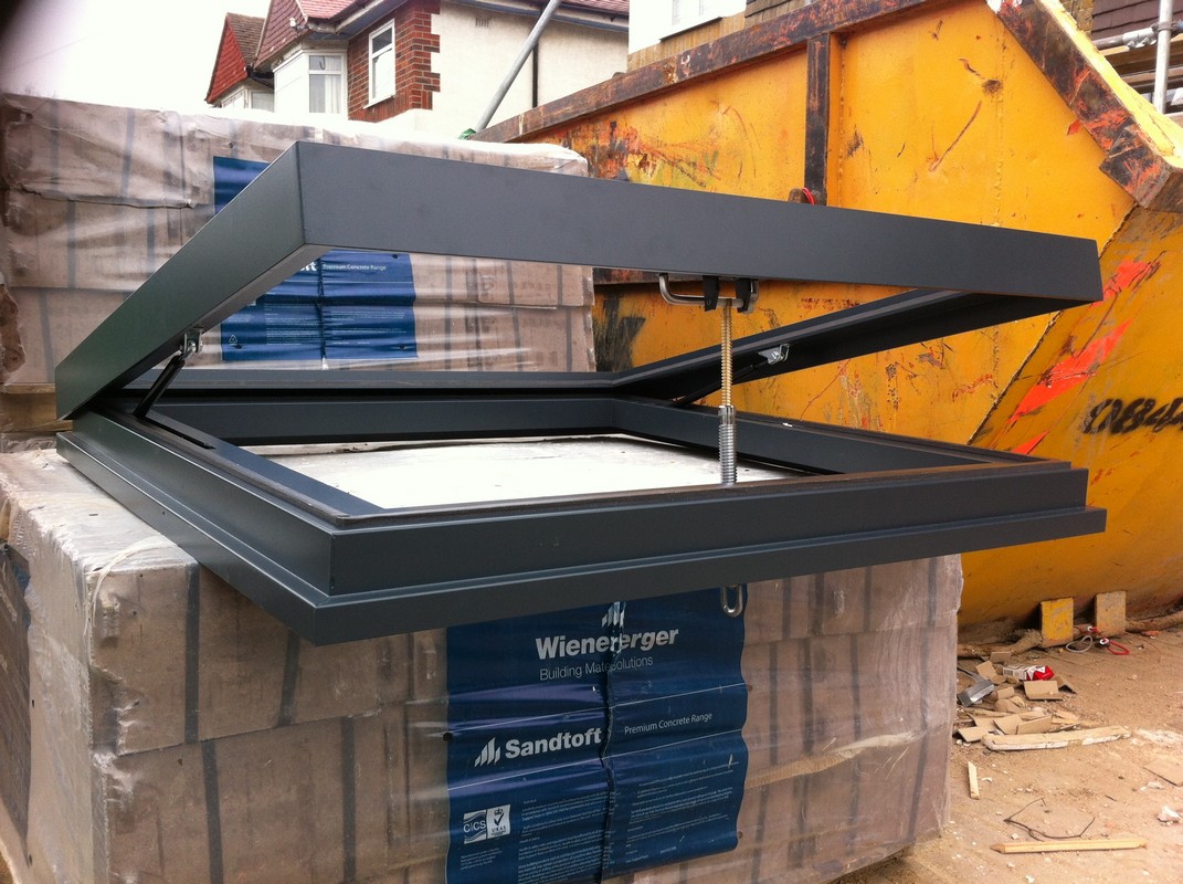 Opening flat roof skylight in anthracite grey installed in Witney