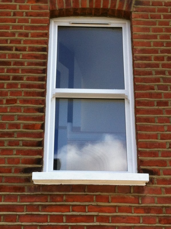 uPVC sash window on Victorian red brick house in Witney